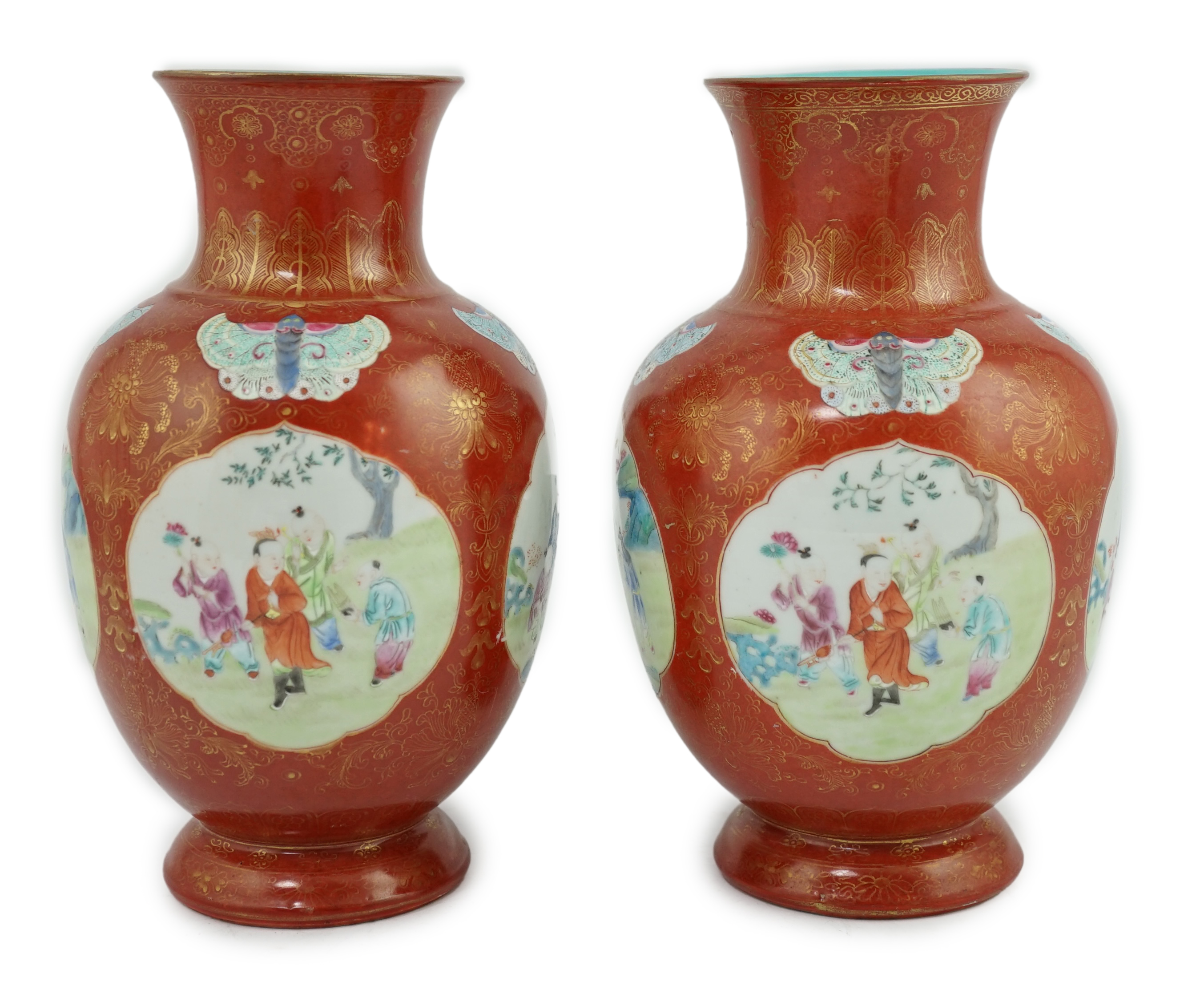 A pair of Chinese coral ground ‘boys’ vases, Jiaqing period (1796-1820)